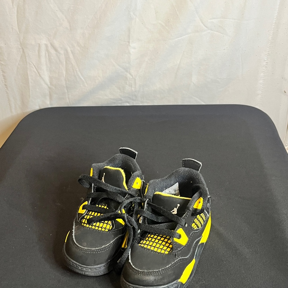 Retro Jordan 4 Black and Yellow Sneakers with Modern Design